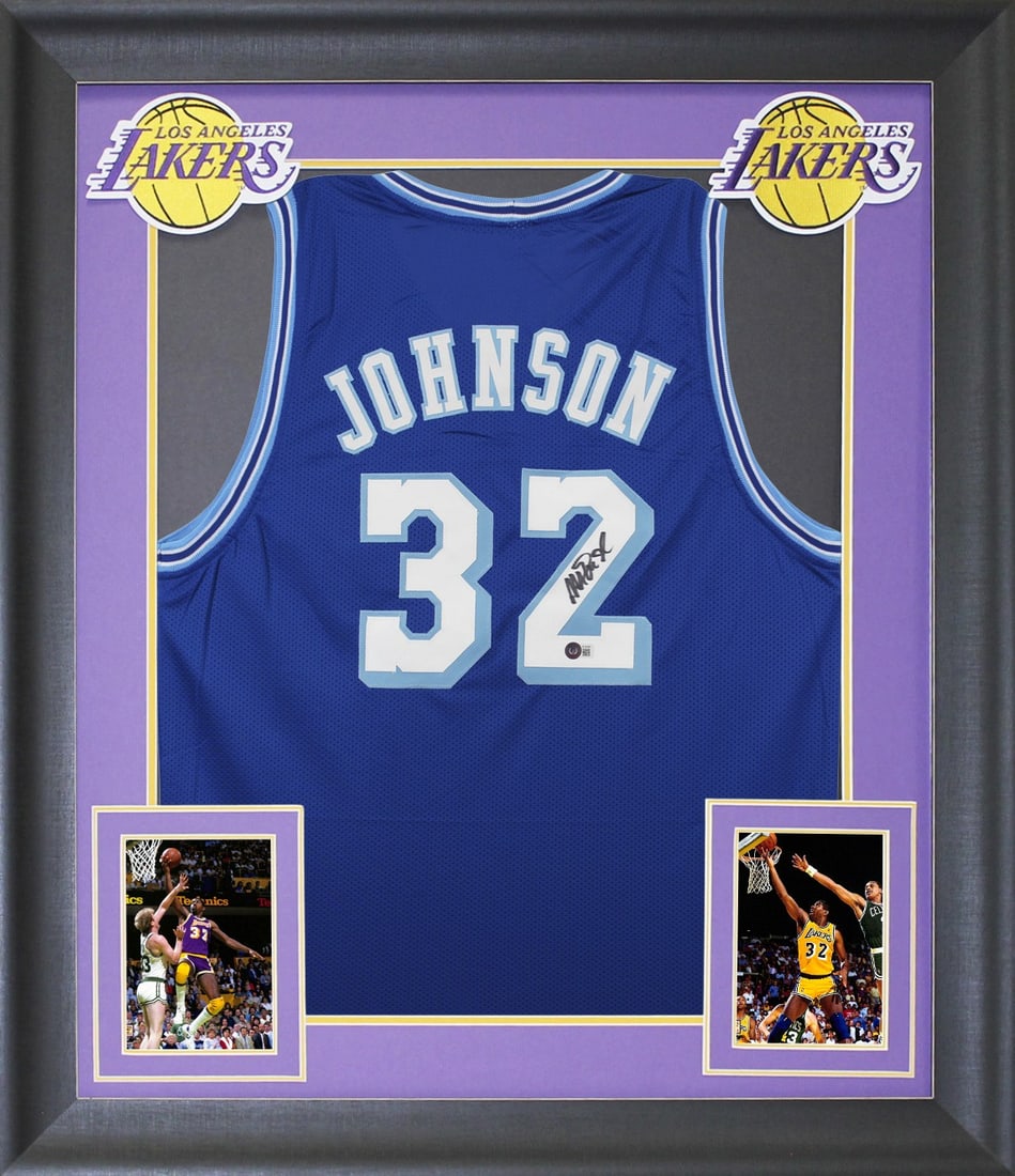 Framed Los Angeles Lakers Jersey Signed by Magic Johnson BAS Witnessed: Framed Los Angeles Lakers Jersey Signed by Magic Johnson BAS Witnessed This professionally framed blue throwback pro style jersey features a hand-signed autograph by Magic Johnson of the Los Angeles L