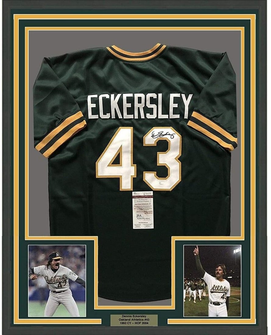 Framed Dennis Eckersley Signed Oakland Athletics Green Jersey JSA COA: Framed Dennis Eckersley Signed Oakland Athletics Green Jersey JSA COA This framed Oakland Athletics green jersey features the autograph of Dennis Eckersley. The signature has been authenticated by Jam