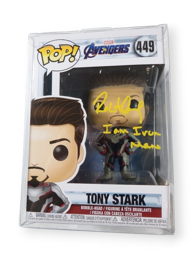 Funko POP Figure Signed by Robert Downey Jr. I am Iron Man Beckett Authenticated: Funko POP Figure Signed by Robert Downey Jr. I am Iron Man Beckett Authenticated This Funko POP! figure features an autograph by Robert Downey Jr. with the inscription "I am Iron Man." The item is aut