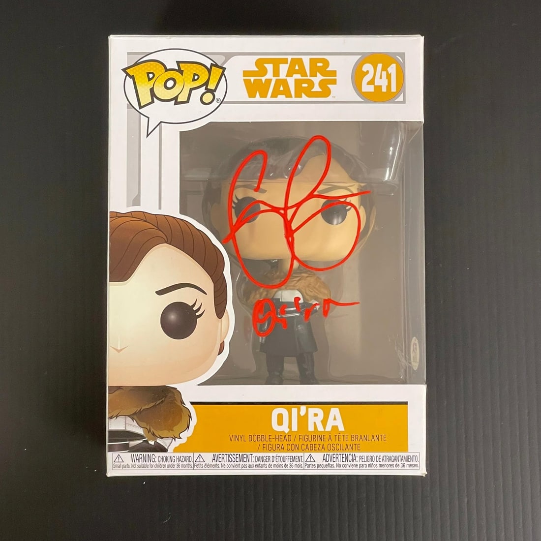 PSA DNA authenticated Emilia Clarke autographed Qi ra Star Wars Funko Pop 241: PSA DNA authenticated Emilia Clarke autographed Qi ra Star Wars Funko Pop 241 This is an original Funko Pop figure of Qi'ra (#241) from the Star Wars franchise, personally signed by Emilia Clarke. The