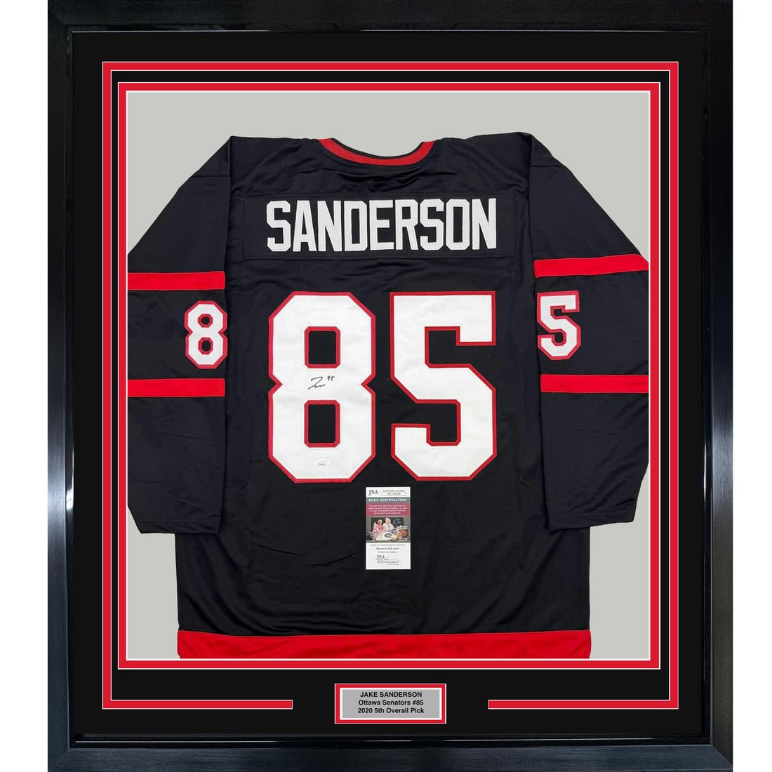 Framed Autographed Jake Sanderson Ottawa Senators Jersey with JSA COA: Framed Autographed Jake Sanderson Ottawa Senators Jersey with JSA COA Celebrate your passion for hockey with this professionally framed autographed Jake Sanderson jersey. The 35x39 inch Ottawa Senator