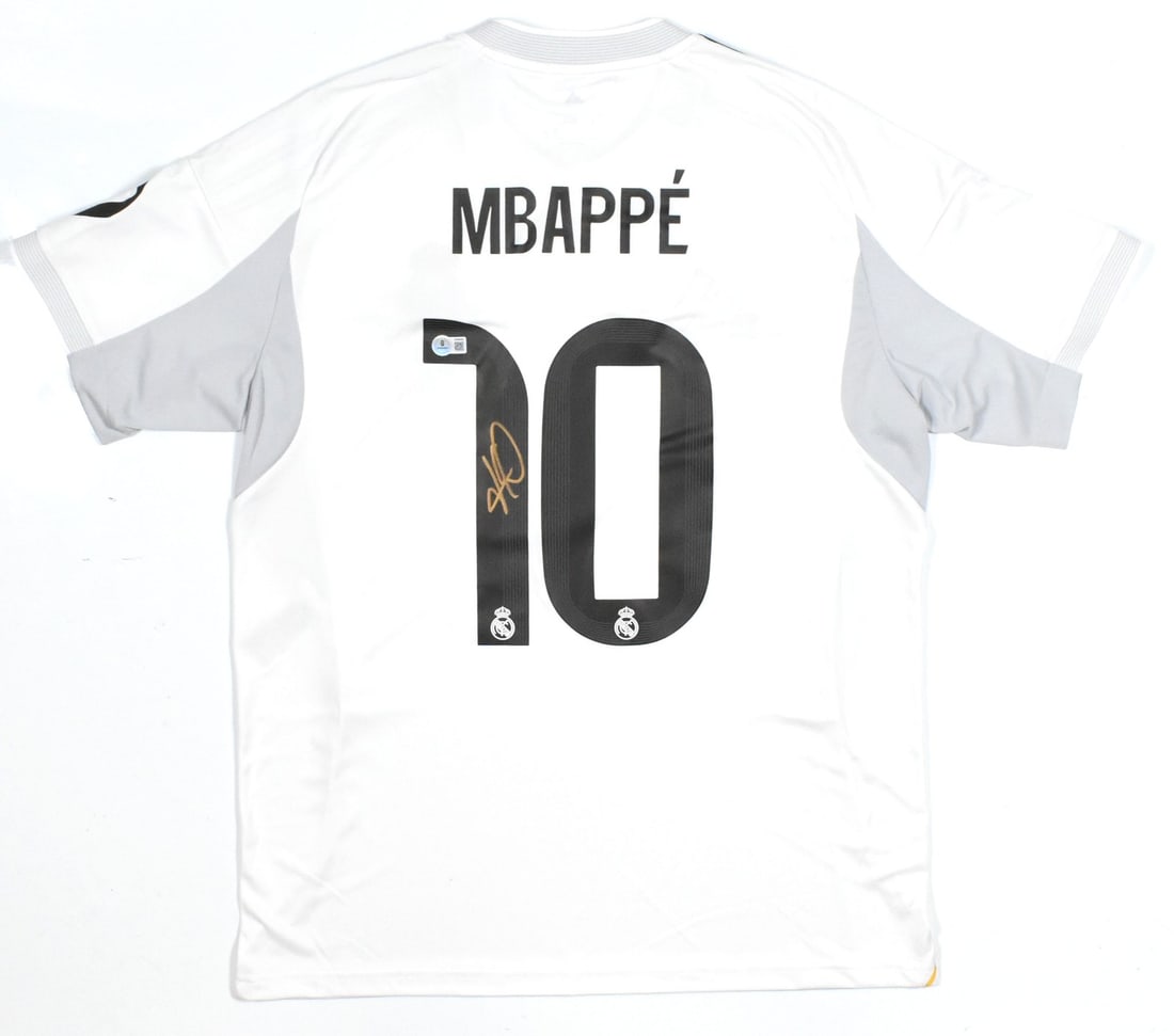 Real Madrid Home Jersey Signed by Kylian Mbappe Beckett Holo L LOA: Real Madrid Home Jersey Signed by Kylian Mbappe Beckett Holo L LOA This is a pre-owned Real Madrid home soccer jersey featuring the number 10 and signed by Kylian Mbappe. The jersey comes with Beckett