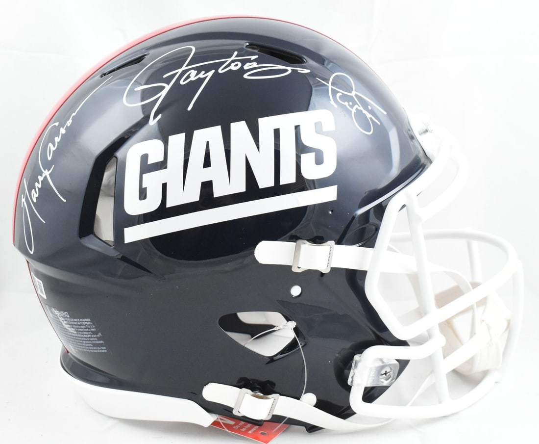 New York Giants Authentic Helmet Signed by Taylor Carson Simms Beckett Hologram: New York Giants Authentic Helmet Signed by Taylor Carson Simms Beckett Hologram This pre-owned New York Giants full-size Speed Authentic helmet features autographs from Taylor, Carson, and Simms. The 