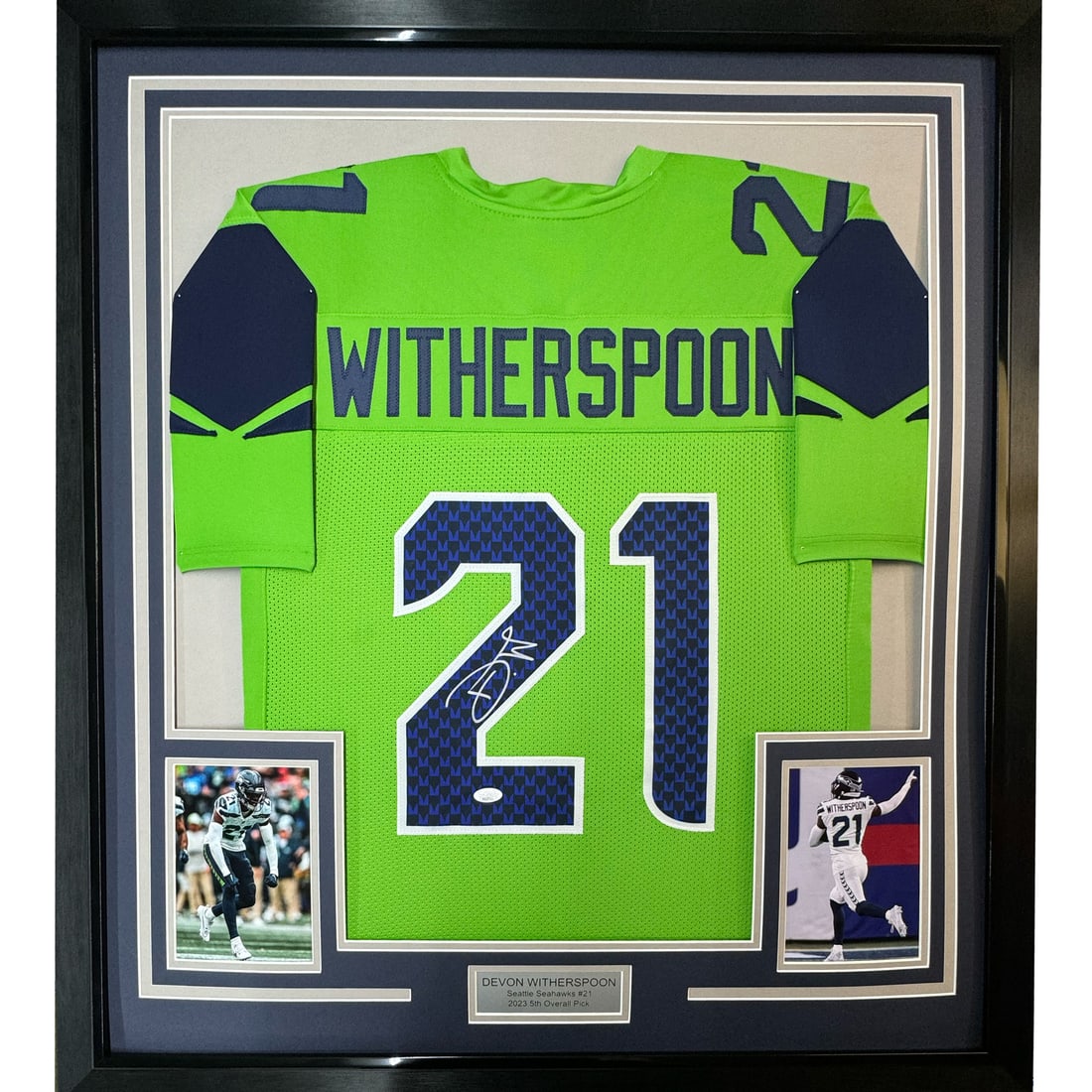 Devon Witherspoon signed Seahawks jersey framed JSA COA 35x39: Devon Witherspoon signed Seahawks jersey framed JSA COA 35x39 This professionally framed and matted display features a Seattle Seahawks green jersey autographed by Devon Witherspoon. The piece include