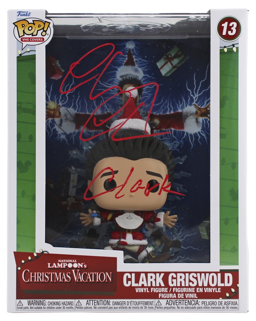 Chevy Chase Signed Funko Pop Clark VHS Cover BAS Authenticated: Chevy Chase Signed Funko Pop Clark VHS Cover BAS Authenticated This autographed Funko Pop vinyl figure features the beloved character "Clark" from National Lampoon's Christmas Vacation, personally sig