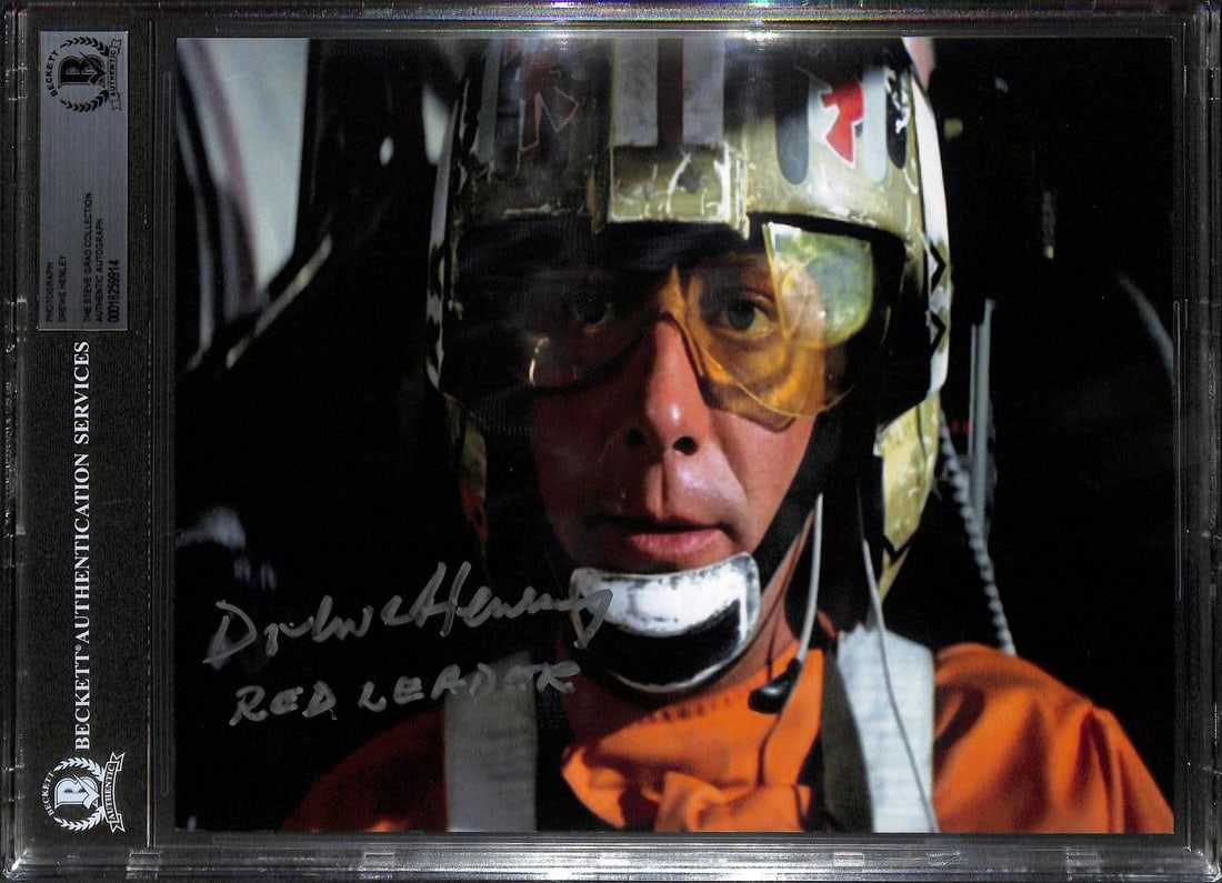 Beckett Slabbed Star Wars 8x10 Photo Signed by Drewe Henley: Beckett Slabbed Star Wars 8x10 Photo Signed by Drewe Henley This 8x10 photograph features Drewe Henley as Red Leader from Star Wars, hand-signed and inscribed "Red Leader" in silver ink. The autograph
