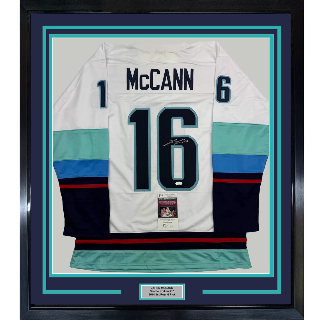 Framed Signed Jared McCann Seattle Kraken Jersey with JSA COA 35x39: Framed Signed Jared McCann Seattle Kraken Jersey with JSA COA 35x39 Celebrate your passion for hockey with this professionally framed and autographed Jared McCann Seattle White Hockey Jersey. Measurin