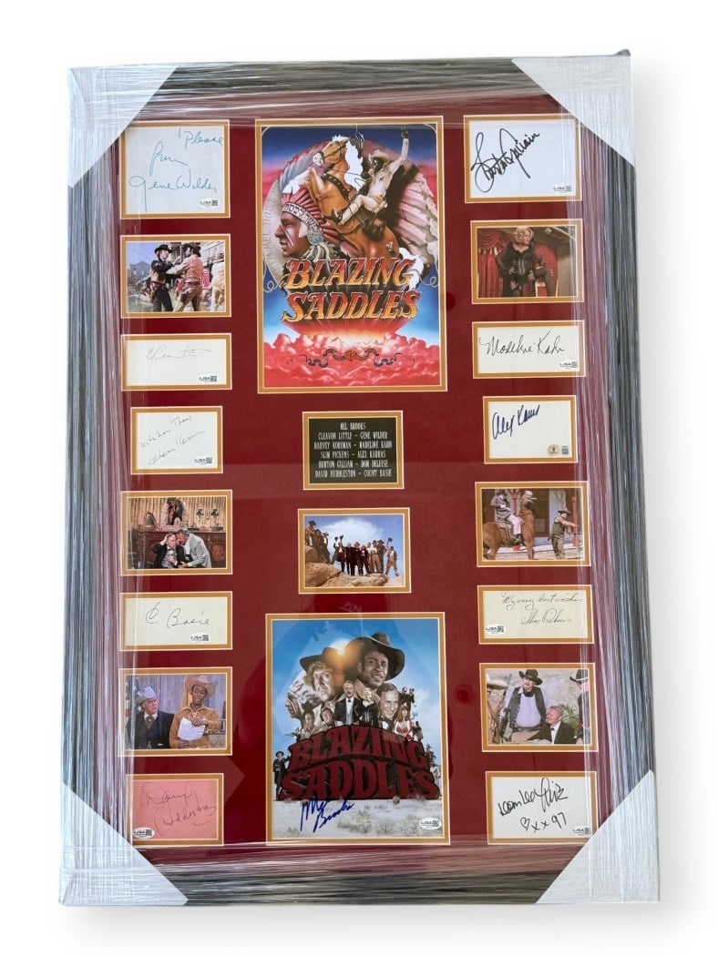 Framed Blazing Saddles Photo with Cast Autographs JSA Authenticated: Framed Blazing Saddles Photo with Cast Autographs JSA Authenticated This framed Blazing Saddles collectible features original cast cut signatures and a photograph. The display includes autographs from