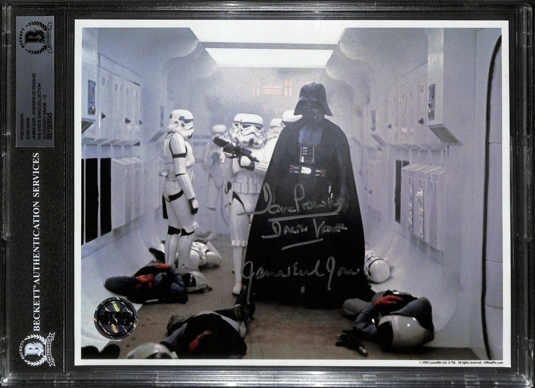 Beckett 10 Graded Star Wars Vader Photo Signed by Jones and Prowse: Beckett 10 Graded Star Wars Vader Photo Signed by Jones and Prowse This 8x10 photograph from the opening scene of Star Wars features Darth Vader and stormtroopers and is officially licensed by Lucasfi