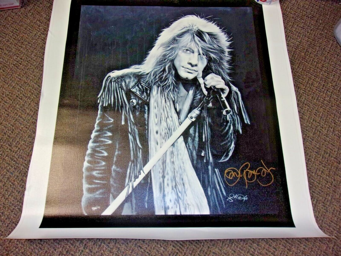 Signed Jon Bon Jovi 32x36 Canvas Photo With COA: Signed Jon Bon Jovi 32x36 Canvas Photo With COA This pre-owned canvas print features Jon Bon Jovi, renowned for the song "Living on a Prayer" and a member of the Music Hall of Fame. The 32x36 inch can