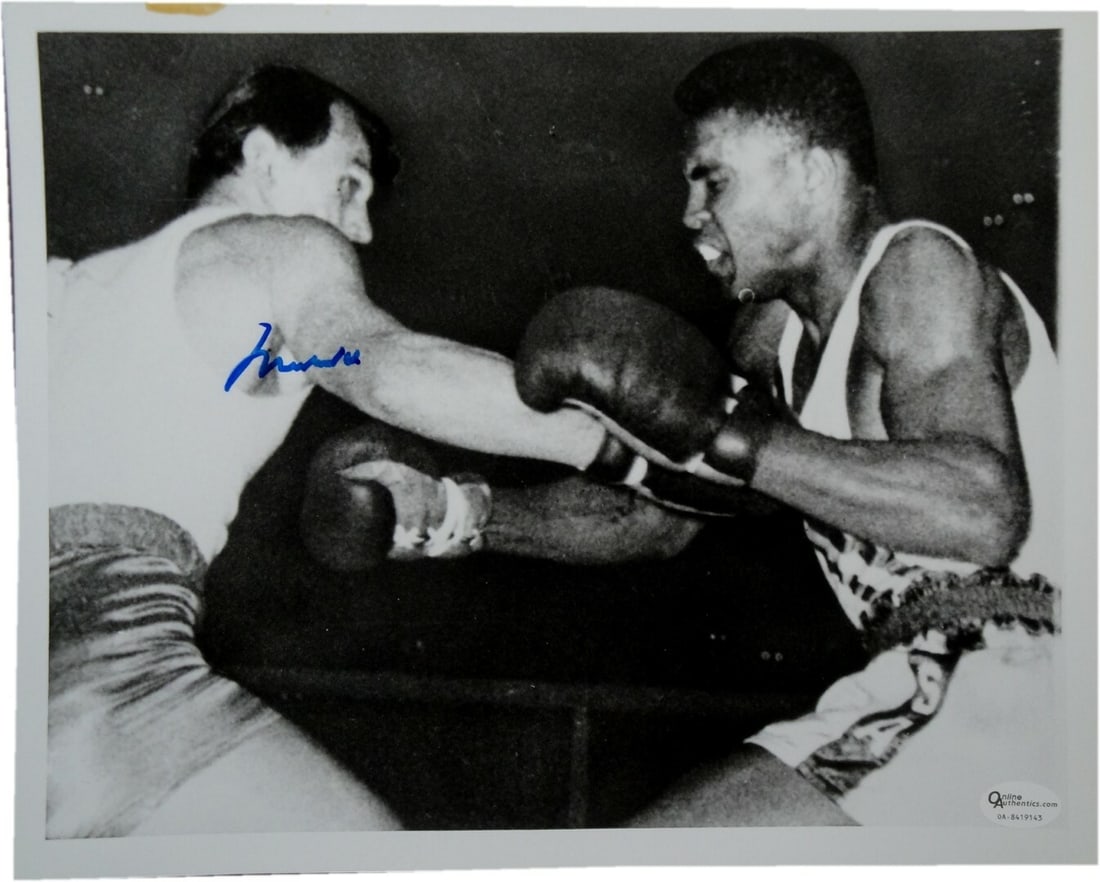Muhammad Ali Hand Signed 8x10 Photo Authenticated by Online Authentics: Muhammad Ali Hand Signed 8x10 Photo Authenticated by Online Authentics This iconic 8x10 photo captures the legendary Muhammad Ali in action on September 5th, 1960. The photograph is hand-signed by Ali