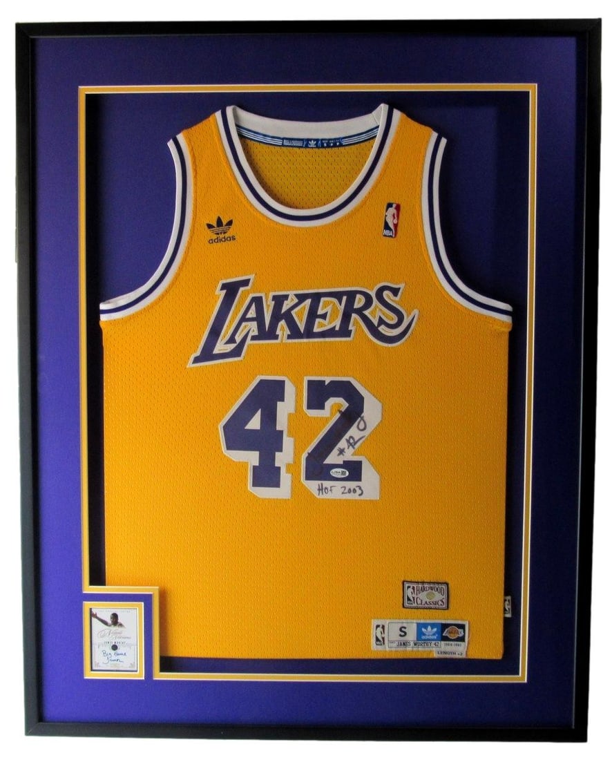 Framed James Worthy Autographed Lakers Jersey With JSA Letter of Authenticity: Framed James Worthy Autographed Lakers Jersey With JSA Letter of Authenticity This framed display features a James Worthy autographed and inscribed Los Angeles Lakers basketball jersey. The jersey is 