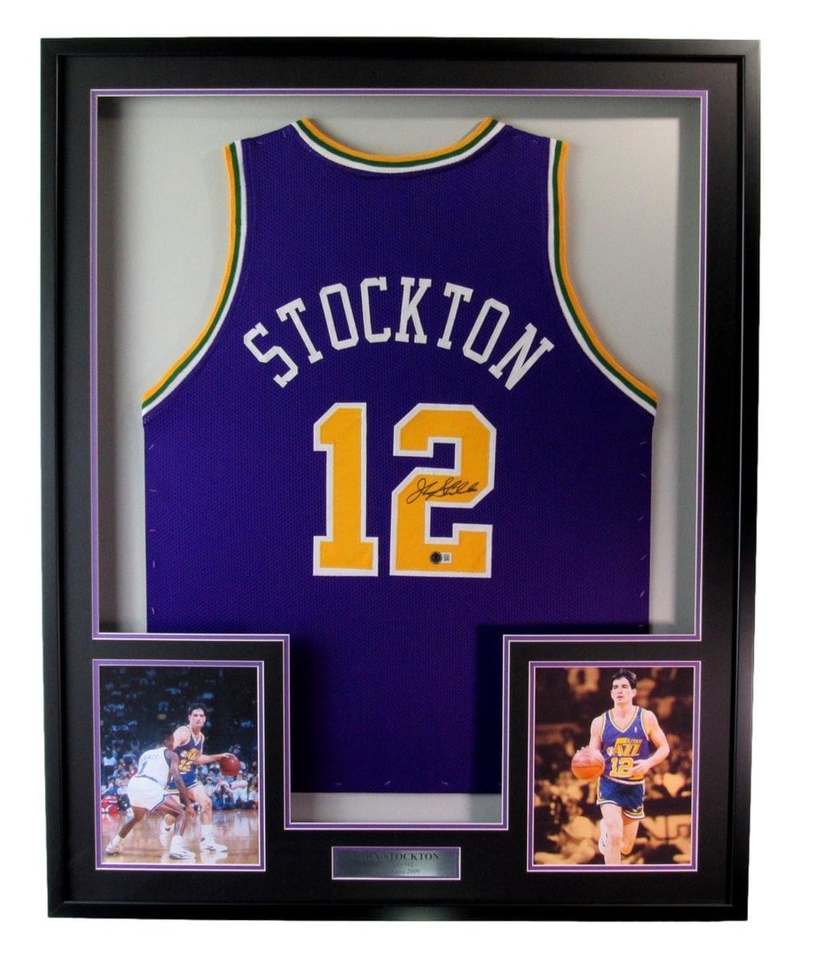 Framed Utah Jazz Jersey Signed by John Stockton Beckett Authenticated: Framed Utah Jazz Jersey Signed by John Stockton Beckett Authenticated This is a framed Utah Jazz jersey autographed by John Stockton. The display includes photos and has been authenticated by Beckett 