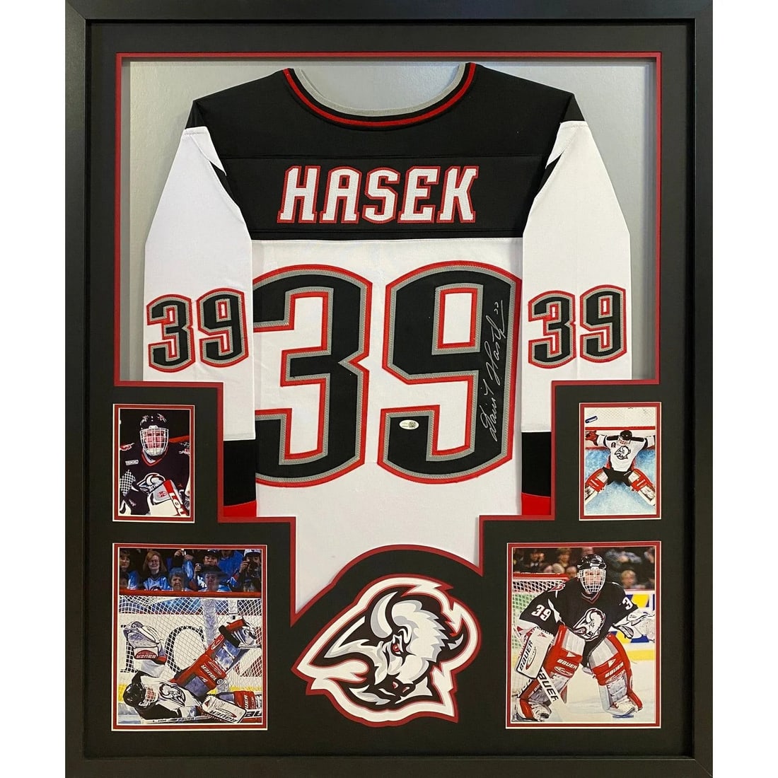Framed Dominik Hasek Buffalo Sabres autographed jersey JSA: Framed Dominik Hasek Buffalo Sabres autographed jersey JSA This framed Buffalo Sabres white jersey is autographed by Dominik Hasek. The jersey is professionally framed with attention to detail, featur