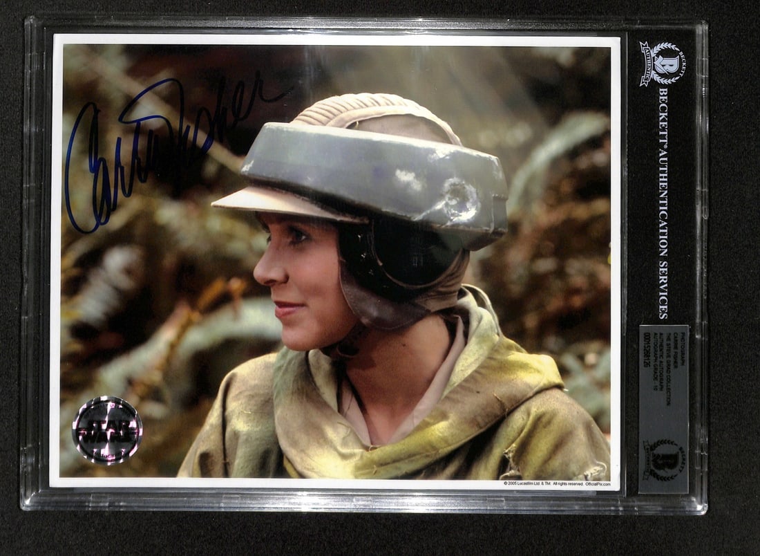 Carrie Fisher Signed Star Wars ROTJ 8x10 Photo BAS 10 Beckett Autograph: Carrie Fisher Signed Star Wars ROTJ 8x10 Photo BAS 10 Beckett Autograph This extraordinary 8x10 photograph features Carrie Fisher as Princess Leia from Star Wars: Return of the Jedi, captured in her i