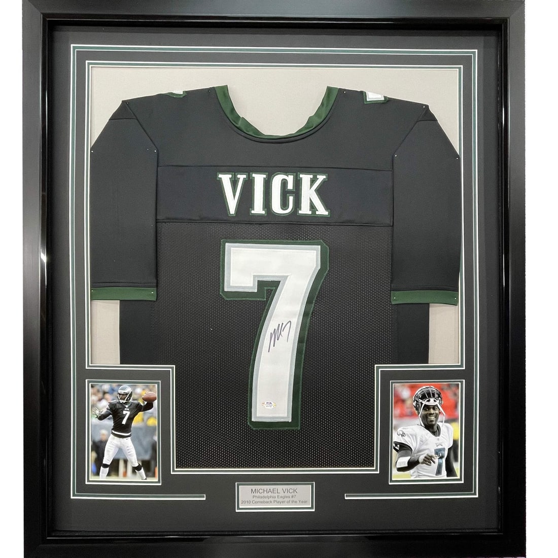 Framed Michael Vick Autographed Jersey Philadelphia Eagles PSA COA 33x42: Framed Michael Vick Autographed Jersey Philadelphia Eagles PSA COA 33x42 This professionally framed and matted display features an autographed black jersey of NFL star Michael Vick, showcasing his sig