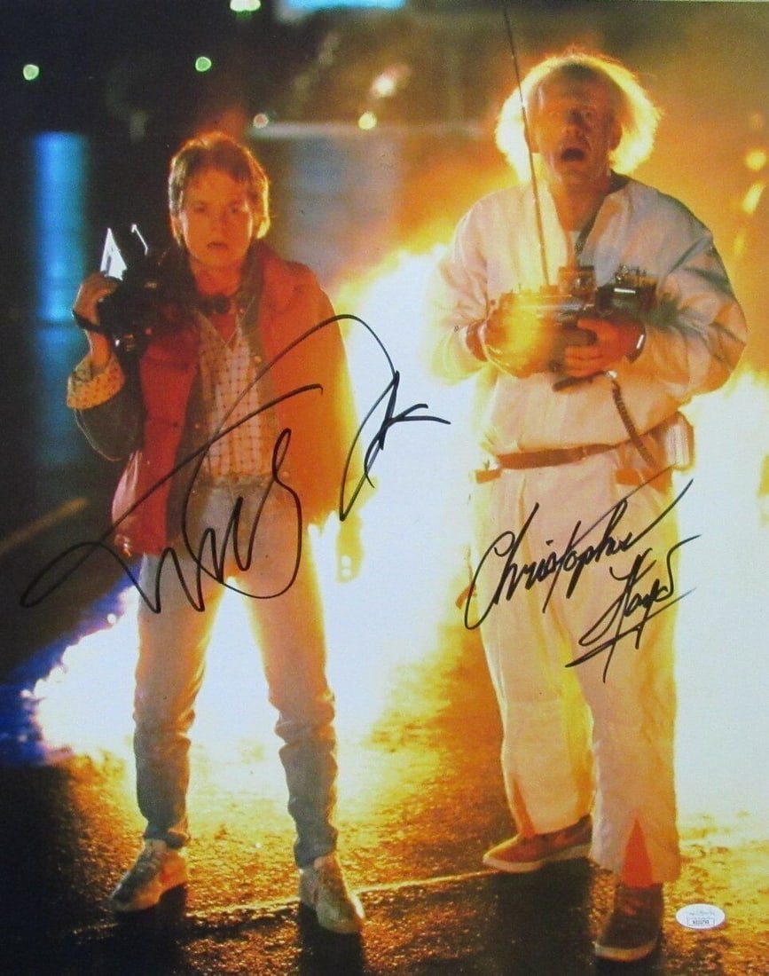 Michael J Fox Christopher Lloyd Dual Autographed 16x20 Back to the Future JSA Certified Photo: Michael J Fox Christopher Lloyd Dual Autographed 16x20 Back to the Future JSA Certified Photo This striking 16x20 photo features the iconic dual signatures of Michael J. Fox and Christopher Lloyd from