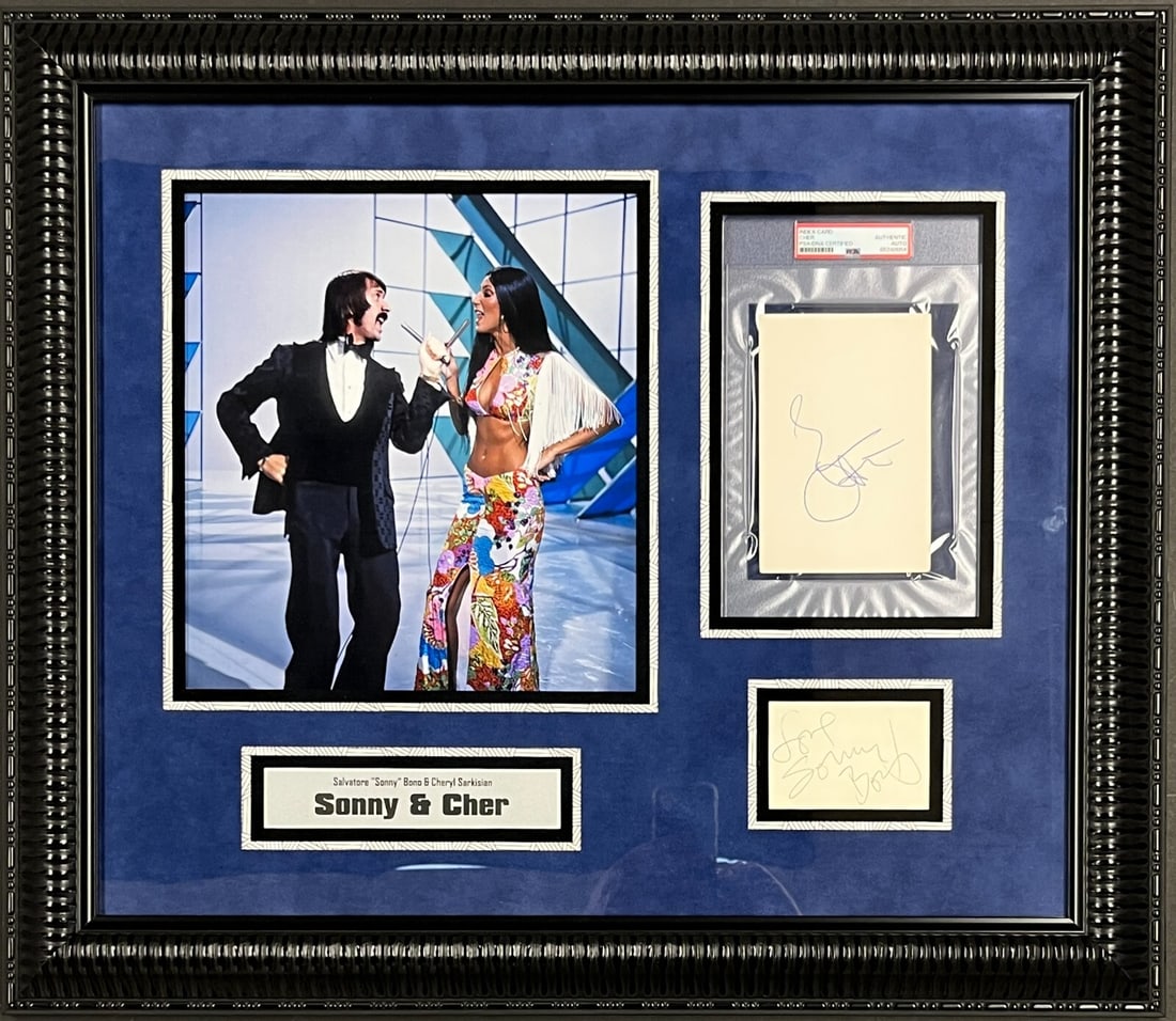 Sonny & Cher Signed Custom Framed Display PSA/JSA 28 x 26: Sonny & Cher Signed Custom Framed Display PSA/JSA 28 x 26 This stunning custom framed display features the authentic signatures of the legendary duo, Sonny Bono and Cher, known for their iconic perfor