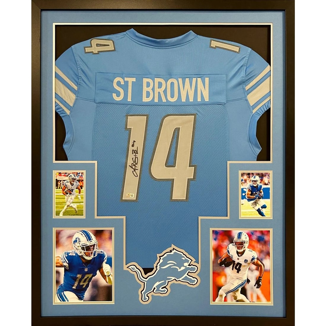 Beckett Authenticated Framed Amon-Ra St. Brown Lions Jersey: Beckett Authenticated Framed Amon-Ra St. Brown Lions Jersey This framed Detroit Lions jersey is autographed by Amon-Ra St. Brown. The jersey is authenticated by Beckett and features a tamper-proof sti