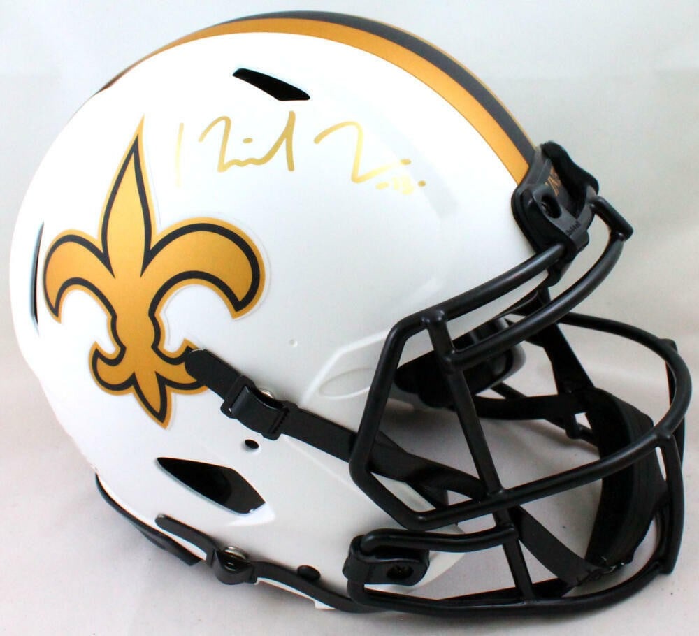 Beckett Authenticated Michael Thomas Saints Lunar Full Size Helmet: Beckett Authenticated Michael Thomas Saints Lunar Full Size Helmet This is an authentic full-size New Orleans Saints Lunar helmet signed by Michael Thomas. The helmet features a gold finish and comes 