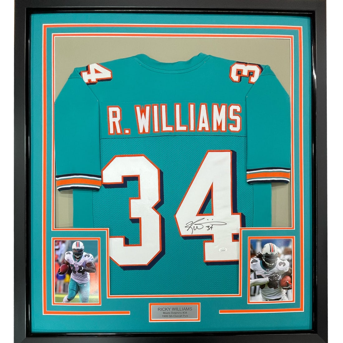 Framed Ricky Williams Miami Dolphins Jersey JSA COA 33x42: Framed Ricky Williams Miami Dolphins Jersey JSA COA 33x42 This professionally framed and matted Miami Dolphins teal jersey features the authentic signature of NFL player Ricky Williams. The display in