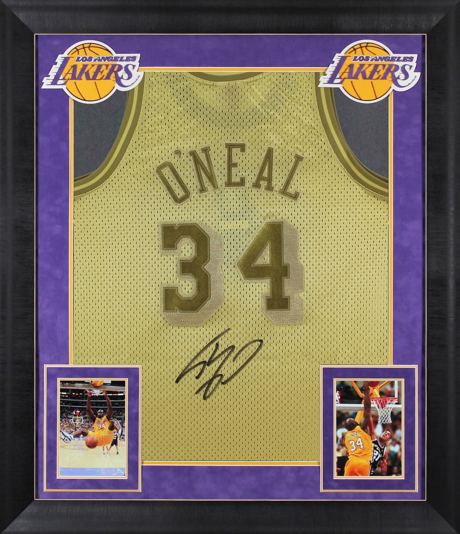 Shaquille O'Neal Signed Gold 96-97 Lakers Framed Jersey BAS Authenticated: Shaquille O'Neal Signed Gold 96-97 Lakers Framed Jersey BAS Authenticated This autographed gold 1996-97 Mitchell & Ness Hardwood Classics Swingman framed jersey has been personally signed by Shaquille