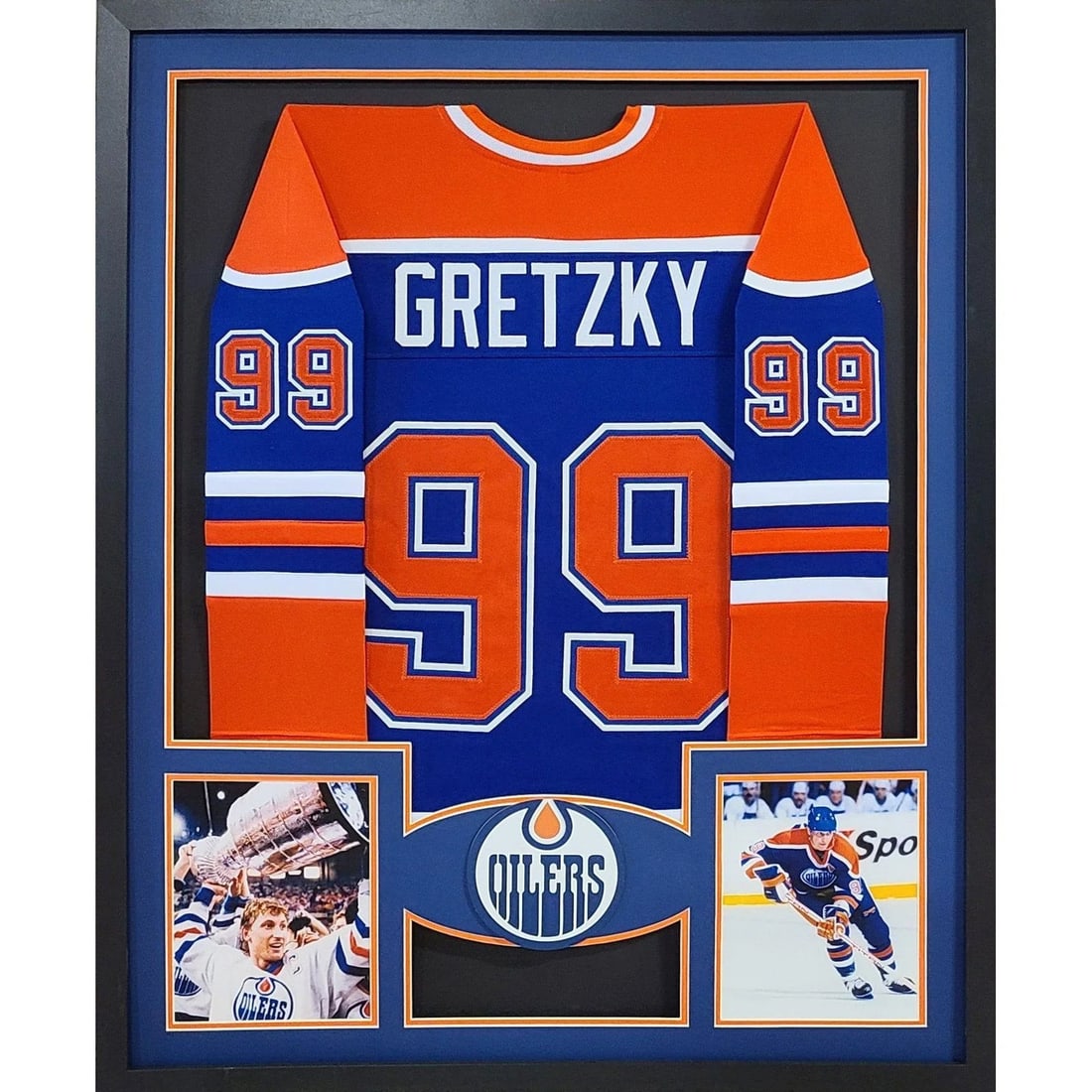 Framed Wayne Gretzky Unsigned Oilers Jersey Blue 42x34: Framed Wayne Gretzky Unsigned Oilers Jersey Blue 42x34 This is a framed blue Edmonton Oilers jersey featuring Wayne Gretzky. The jersey is unsigned and professionally framed with attention to detail, 