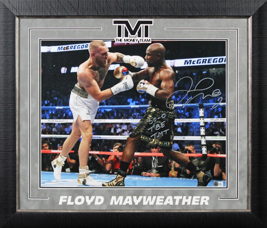 Floyd Mayweather Signed 16x20 Framed Photo 50-0 TBE TMT Beckett Authenticated: Floyd Mayweather Signed 16x20 Framed Photo 50-0 TBE TMT Beckett Authenticated This authentic 16x20 framed photo of boxing legend Floyd Mayweather features the inscription "50-0 TBE TMT" and is persona