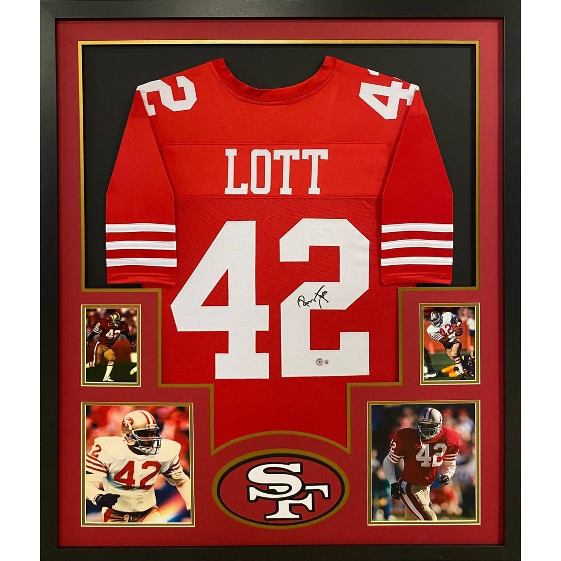 Beckett Authenticated Ronnie Lott Framed 49ers Signed Jersey: Beckett Authenticated Ronnie Lott Framed 49ers Signed Jersey This is a framed San Francisco 49ers jersey autographed by Ronnie Lott. The jersey features detailed framing and the team logo, and is prot