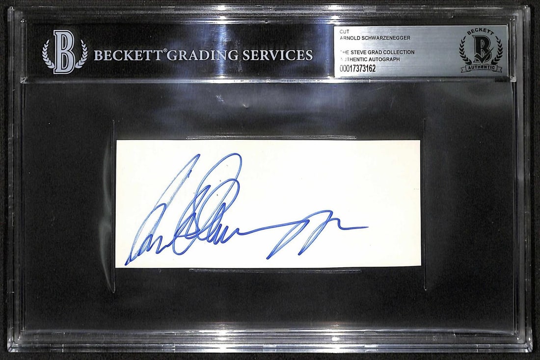 Beckett slabbed Arnold Schwarzenegger autograph cut 1988: Beckett slabbed Arnold Schwarzenegger autograph cut 1988 This vintage signed cut features the autograph of Arnold Schwarzenegger, obtained in person in 1988 at Comiskey Park after he threw out the fir