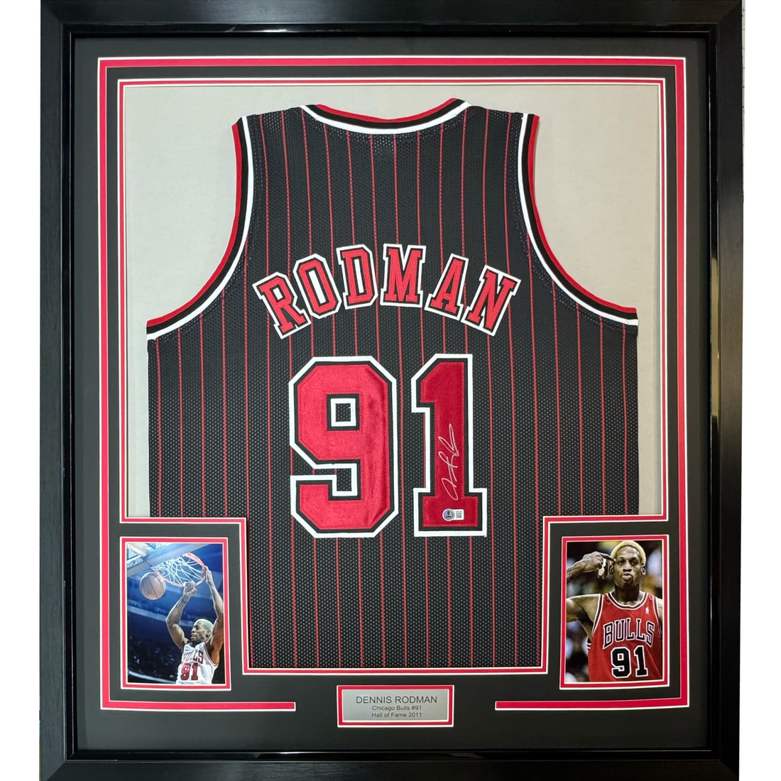 Framed Dennis Rodman signed Chicago pinstripe jersey PSA COA 33x42: Framed Dennis Rodman signed Chicago pinstripe jersey PSA COA 33x42 This professionally framed and matted Chicago Bulls pinstripe jersey features the authentic autograph of Dennis Rodman and is accompa
