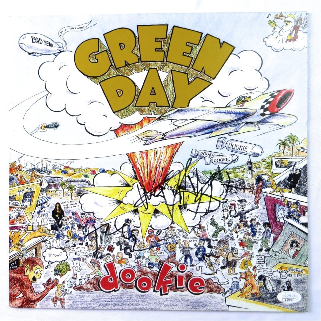 Tre Cool Mike Dirnt Signed Dookie Album Cover Green Day JSA: Tre Cool Mike Dirnt Signed Dookie Album Cover Green Day JSA This is an original autographed record album cover of Green Day's "Dookie," featuring signatures from band members Tre Cool and Mike Dirnt. 