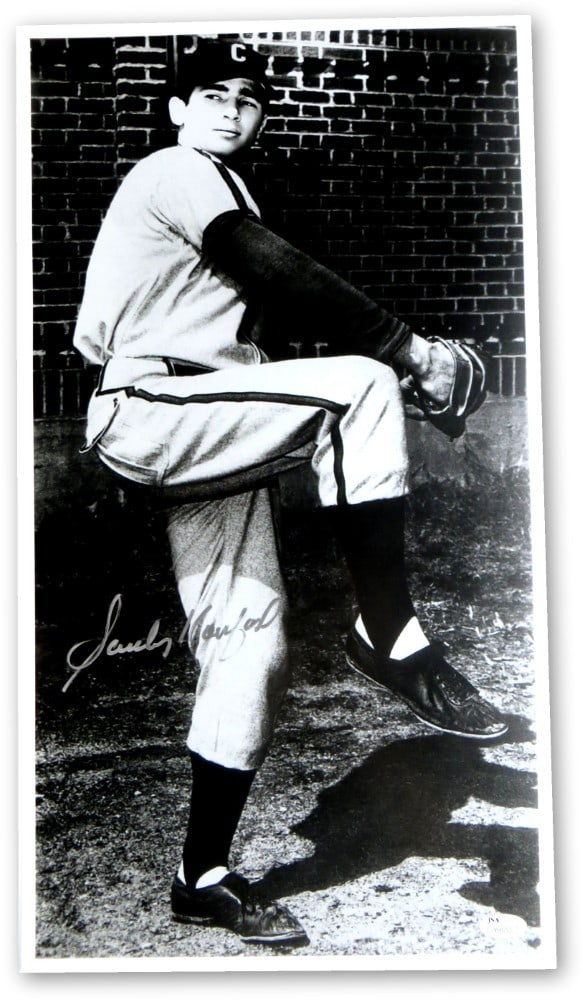 Sandy Koufax Autographed 11x20 Photo Dodgers JSA Certified: Sandy Koufax Autographed 11x20 Photo Dodgers JSA Certified Celebrate the legacy of Sandy Koufax with this authentic signed 11x20 photo capturing a rare moment from his single season at the University 