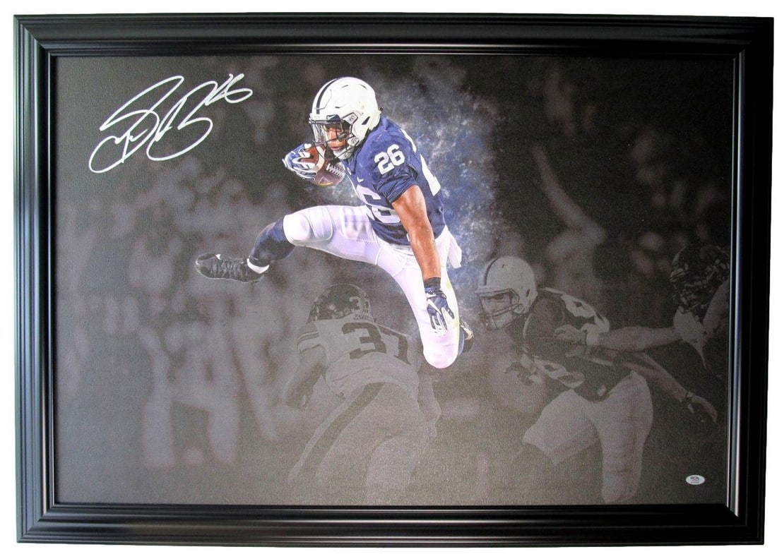 Framed 24x36 Canvas Photo Signed by Saquon Barkley PSA/DNA Authenticated: Framed 24x36 Canvas Photo Signed by Saquon Barkley PSA/DNA Authenticated This framed canvas photo features Saquon Barkley and has been personally autographed by the athlete. Measuring 24" x 36", the c