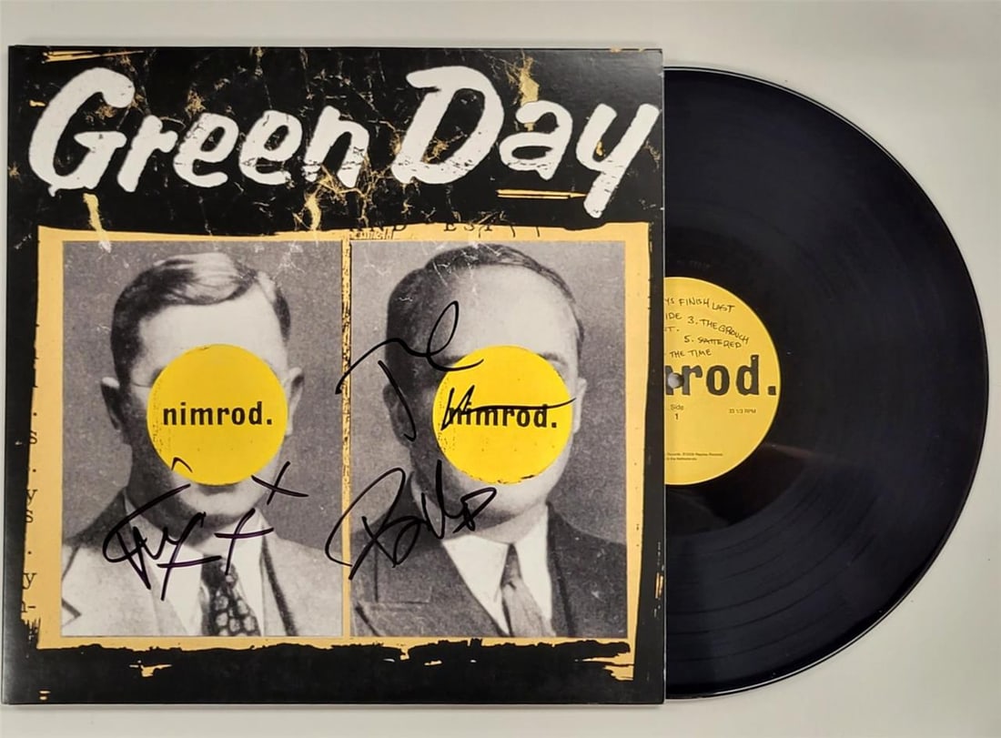 Green Day Nimrod signed vinyl cover Beckett 3 autographs: Green Day Nimrod signed vinyl cover Beckett 3 autographs This original Green Day "Nimrod" vinyl album cover features signatures from three band members: Billie Joe Armstrong, Mike Dirnt, and Tre Cool.