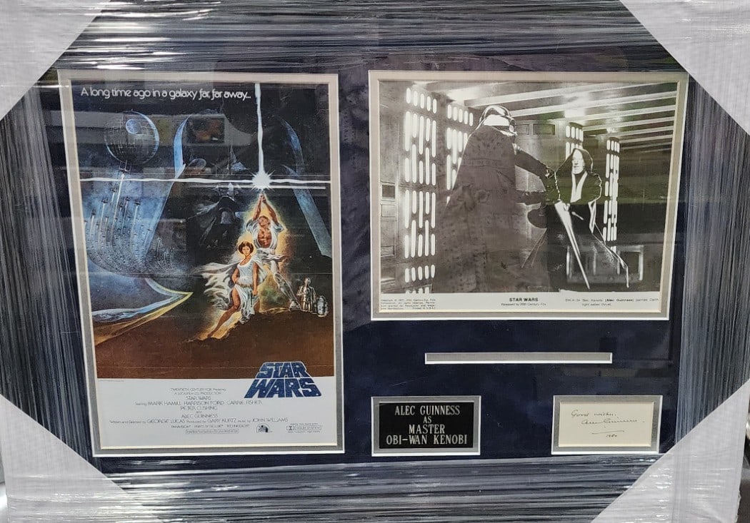 Framed Alec Guinness JSA Authenticated Obi-Wan Kenobi Signed Cut Display: Framed Alec Guinness JSA Authenticated Obi-Wan Kenobi Signed Cut Display This framed display features an authentic autographed cut signed by Alec Guinness, known for his role as Obi-Wan Kenobi in Star