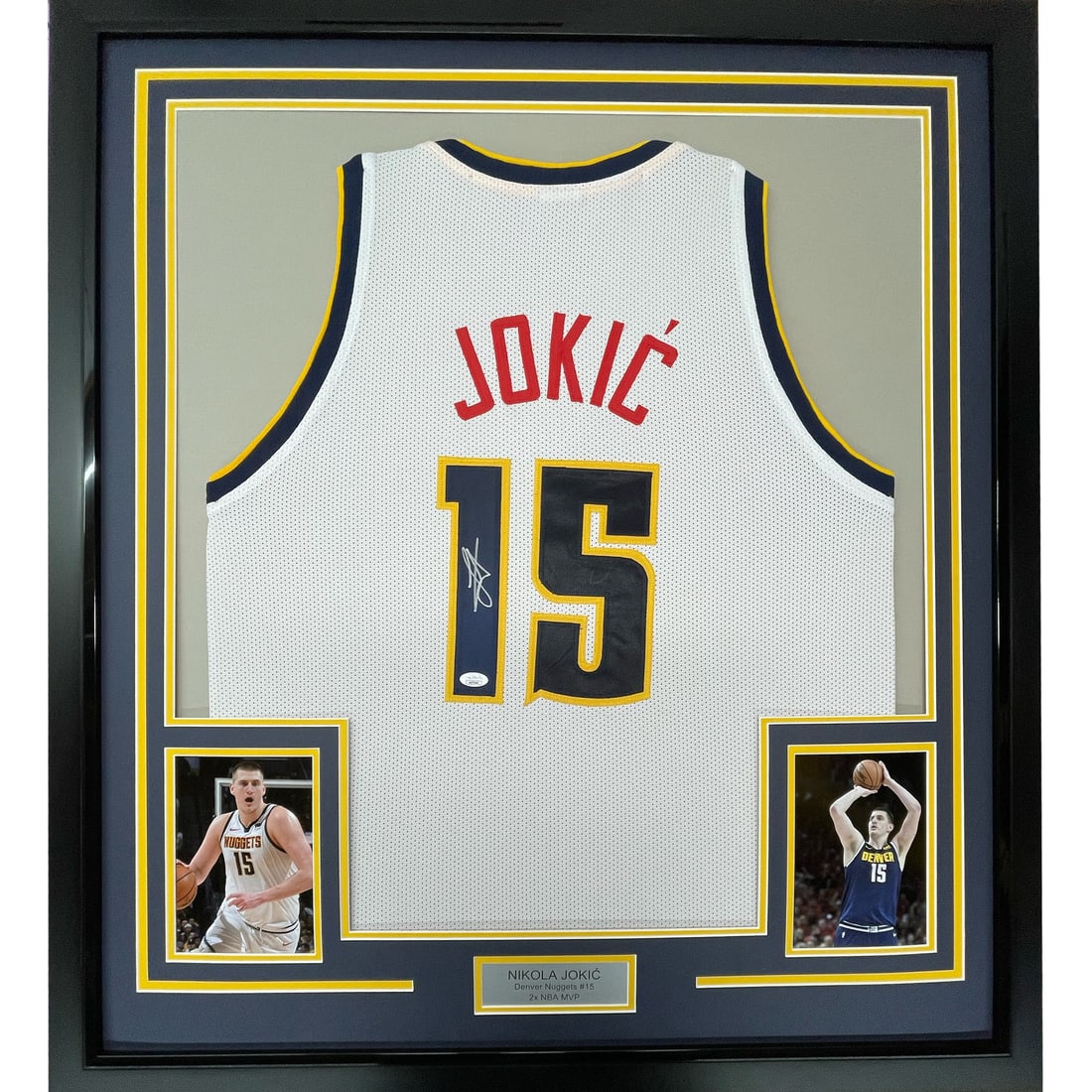 Framed Nikola Jokic Signed 33x42 Denver Nuggets Jersey JSA COA: Framed Nikola Jokic Signed 33x42 Denver Nuggets Jersey JSA COA Celebrate the brilliance of Nikola Jokic with this professionally framed and autographed Denver Nuggets white jersey. Featuring the iconi
