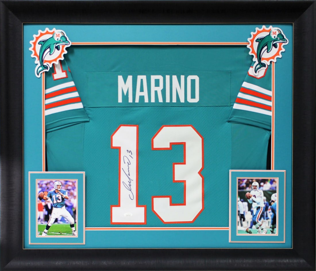 Framed Miami Dolphins Jersey Signed by Dan Marino JSA Witnessed COA: Framed Miami Dolphins Jersey Signed by Dan Marino JSA Witnessed COA This is an original, professionally framed teal pro style jersey personally signed by Dan Marino of the Miami Dolphins. The autograp