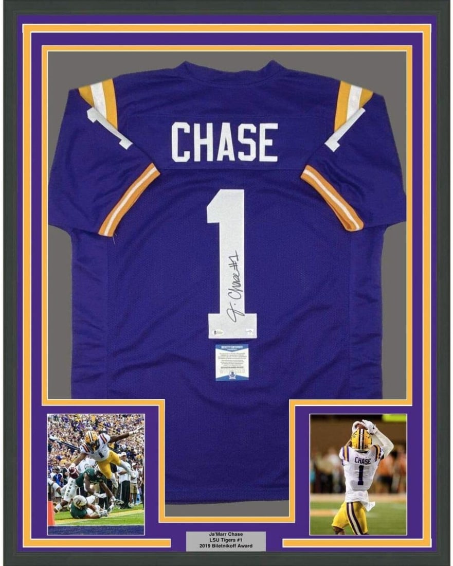 Ja'Marr Chase Signed LSU Purple Jersey 35x39 Framed Beckett COA: Ja'Marr Chase Signed LSU Purple Jersey 35x39 Framed Beckett COA This framed display features a Ja'Marr Chase LSU Tigers purple jersey, hand-signed by Ja'Marr Chase. The jersey is professionally framed