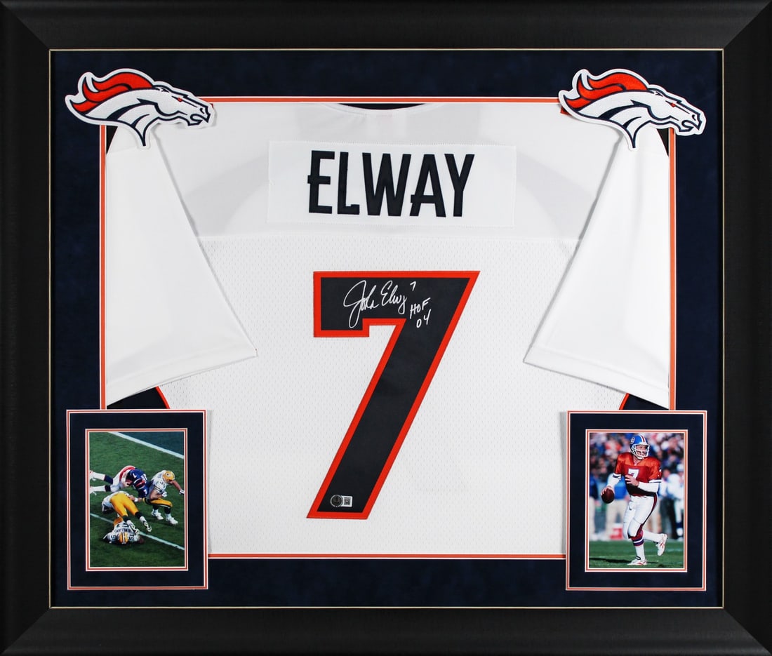 John Elway Signed 1998 Broncos Throwback Jersey HOF 04 BAS Authenticated Framed: John Elway Signed 1998 Broncos Throwback Jersey HOF 04 BAS Authenticated Framed This stunning autographed white 1998 Mitchell & Ness throwback jersey features John Elway, a legendary player for the De