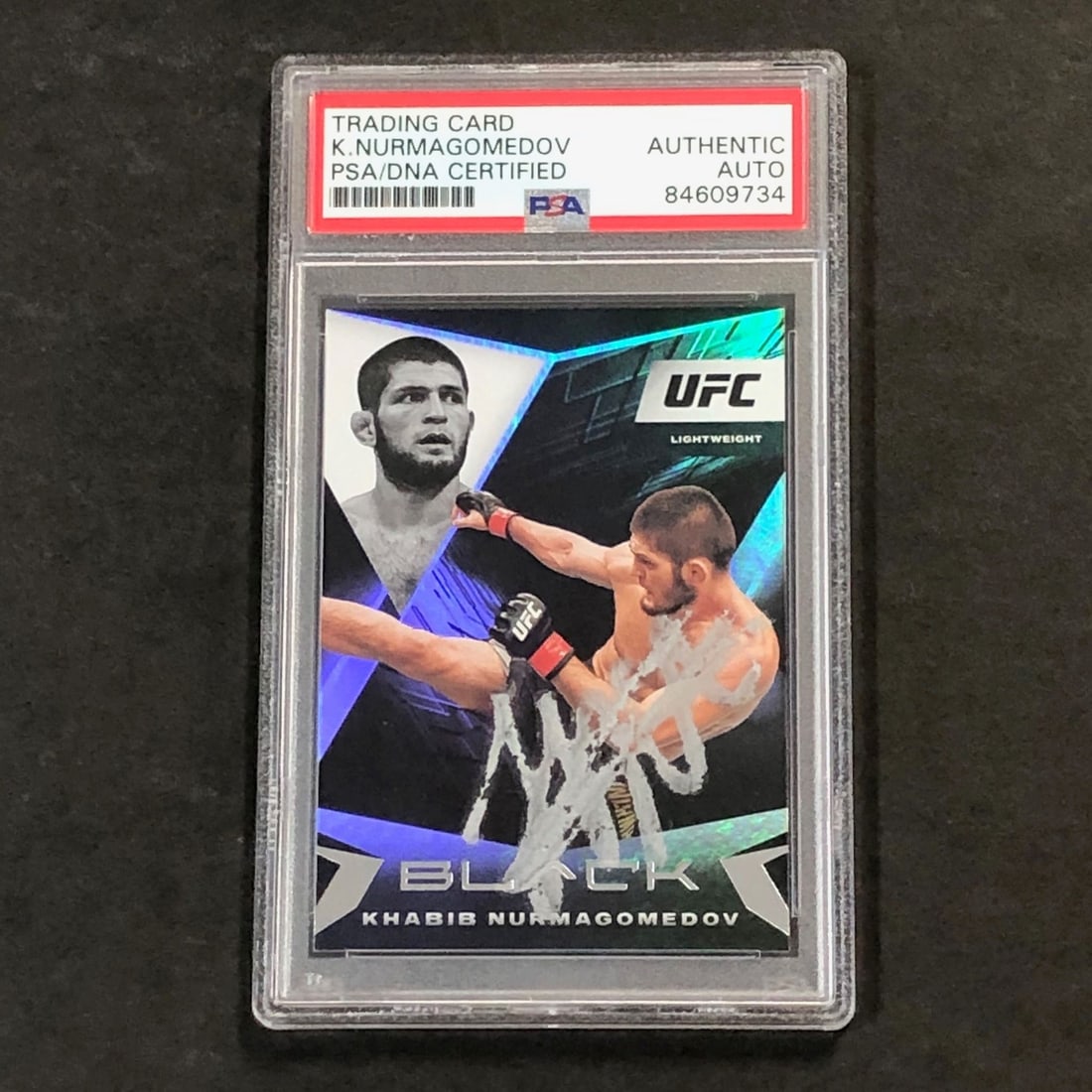 Khabib Nurmagomedov Signed 2021 Panini Chronicles Black Card PSA Authenticated: Khabib Nurmagomedov Signed 2021 Panini Chronicles Black Card PSA Authenticated This is a 2021 Panini Chronicles Black #106 trading card featuring Khabib Nurmagomedov. The card is signed by Khabib Nurm