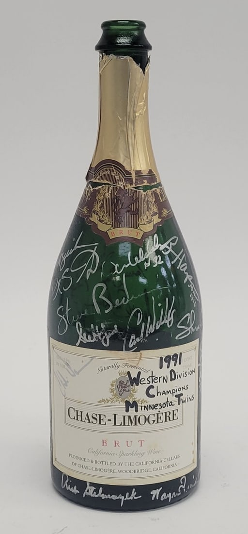1991 Minnesota Twins Signed Game Used Champagne Bottle Beckett Authenticated: 1991 Minnesota Twins Signed Game Used Champagne Bottle Beckett Authenticated Celebrate the legacy of the 1991 Minnesota Twins with this authentic team-signed champagne bottle from their Western Divisi