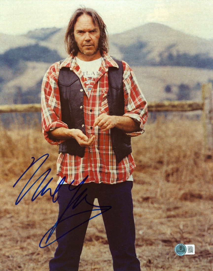 Neil Young Signed 11x14 Photo CSN&Y Beckett Certified: Neil Young Signed 11x14 Photo CSN&Y Beckett Certified This authentic 11x14 photograph features the signature of Neil Young, a legendary member of Crosby, Stills, Nash & Young. The photo is accompanied