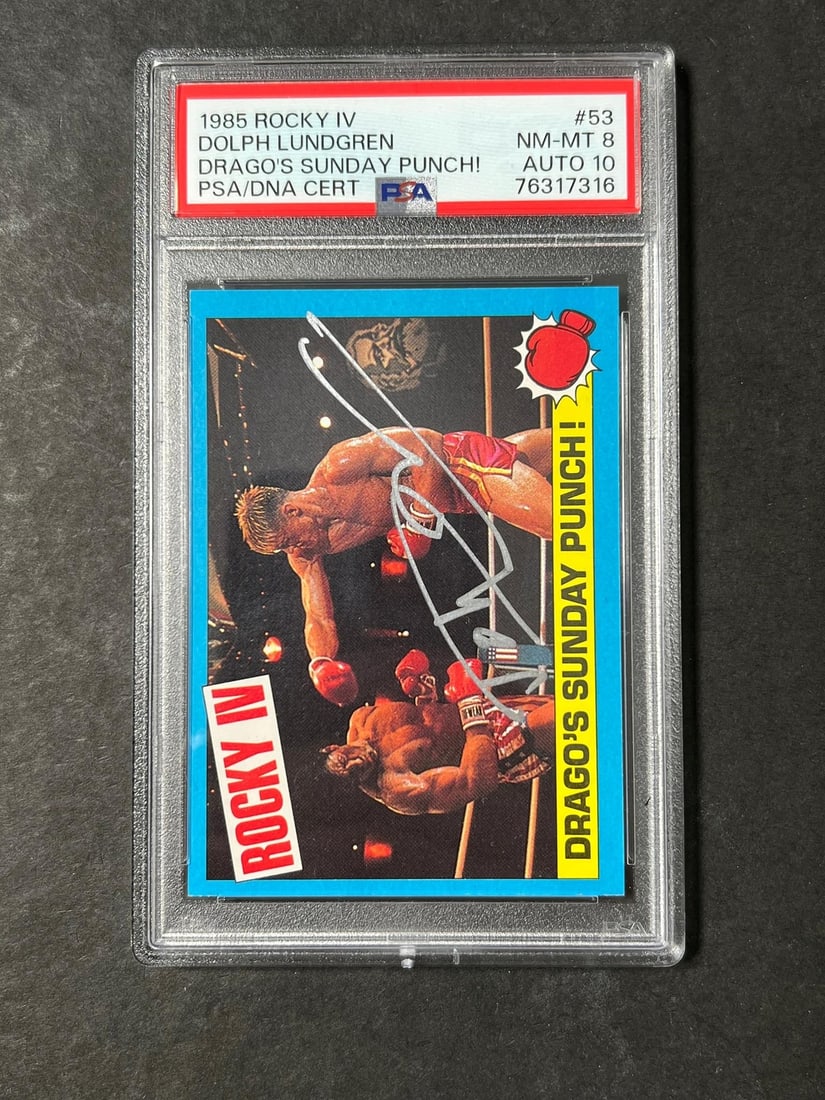 Dolph Lundgren signed 1985 Topps Rocky IV card PSA 8: Dolph Lundgren signed 1985 Topps Rocky IV card PSA 8 This is an original 1985 Topps Rocky IV #53 sports trading card featuring Ivan Drago, signed by Dolph Lundgren. The card has been professionally gr