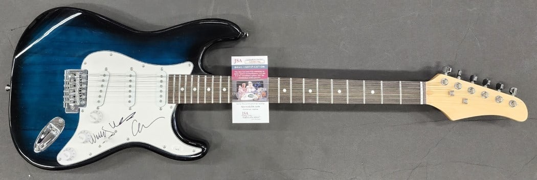 Carnie Wilson Wendy Wilson Autographed Electric Guitar JSA Certified: Carnie Wilson Wendy Wilson Autographed Electric Guitar JSA Certified This is an authentic electric guitar autographed by Carnie Wilson and Wendy Wilson. The signature has been authenticated by James S