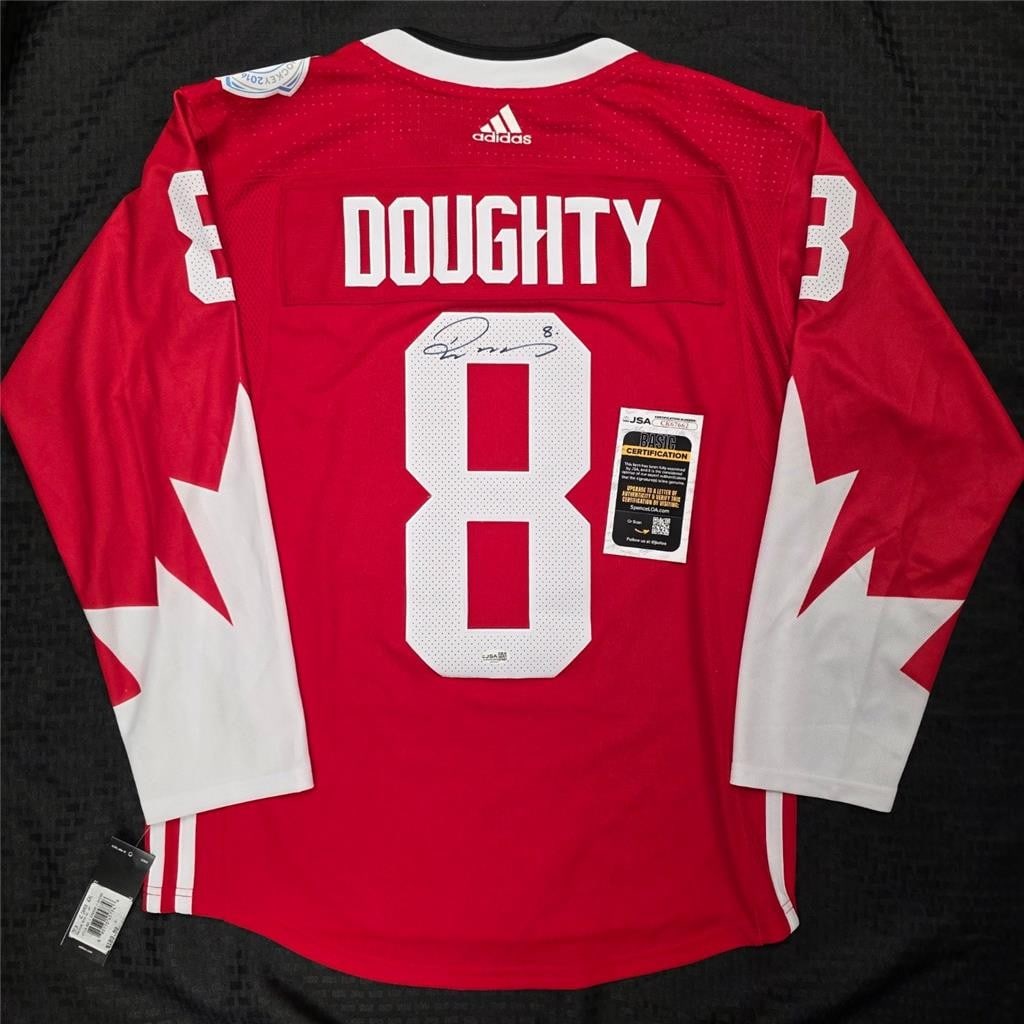 Autographed Adidas Team Canada Hockey Jersey by Drew Doughty JSA Authenticated: Autographed Adidas Team Canada Hockey Jersey by Drew Doughty JSA Authenticated This official Adidas Team Canada World Cup hockey jersey features the autograph of Drew Doughty. The signature is authent