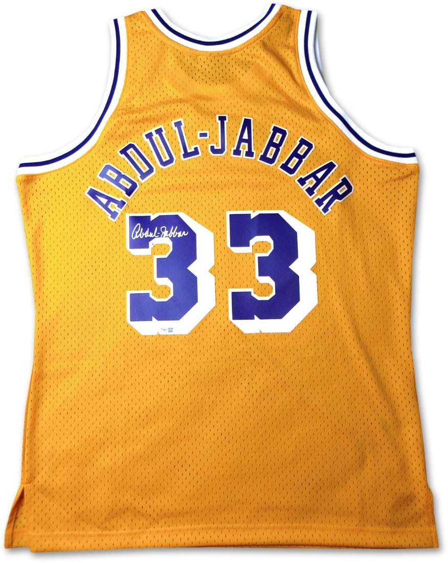 Kareem Abdul-Jabbar Autographed Yellow Lakers Jersey Mitchell & Ness: Kareem Abdul-Jabbar Autographed Yellow Lakers Jersey Mitchell & Ness Celebrate the legacy of basketball legend Kareem Abdul-Jabbar with this signed Mitchell & Ness yellow home jersey. This original pi
