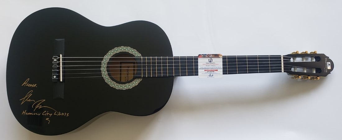 Keola Beamer signed black acoustic guitar with pick GAI authenticated: Keola Beamer signed black acoustic guitar with pick GAI authenticated This black acoustic guitar has been hand signed by Keola Beamer. The autograph has been authenticated by Global Authentics (GAI). 