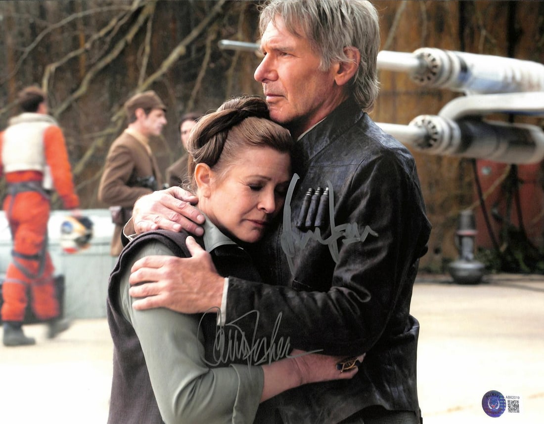 Beckett Authenticated Star Wars 16x20 Photo Signed by Ford and Fisher: Beckett Authenticated Star Wars 16x20 Photo Signed by Ford and Fisher This is a 16x20 photograph from Star Wars: The Force Awakens, hand-signed by Harrison Ford and Carrie Fisher. The photo captures a