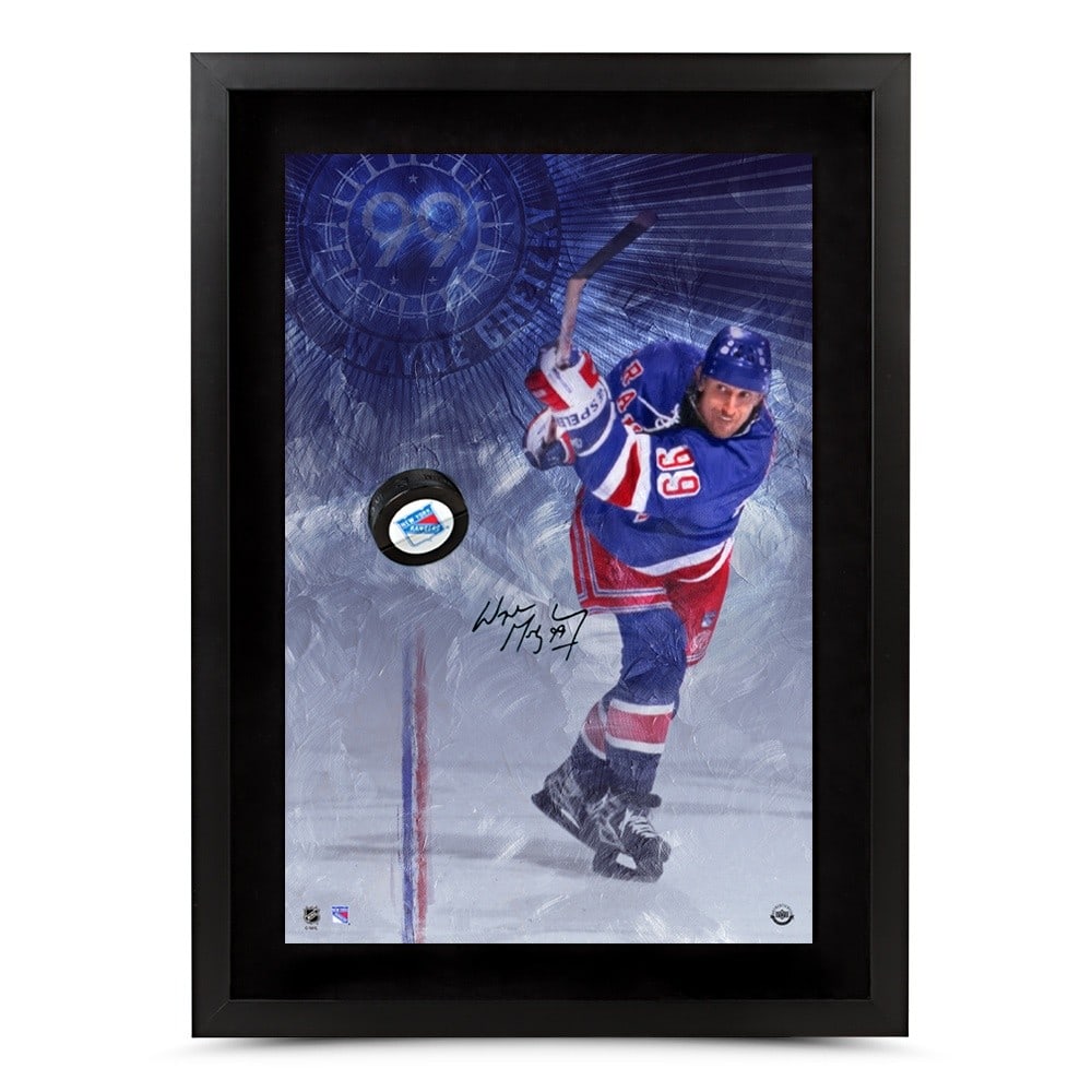 Wayne Gretzky Autographed 16x24 Photo Puck Slap Shot Upper Deck: Wayne Gretzky Autographed 16x24 Photo Puck Slap Shot Upper Deck This striking 16X24 photo captures Wayne Gretzky in action as he breaks through the New York Rangers defense. The photograph is autograp